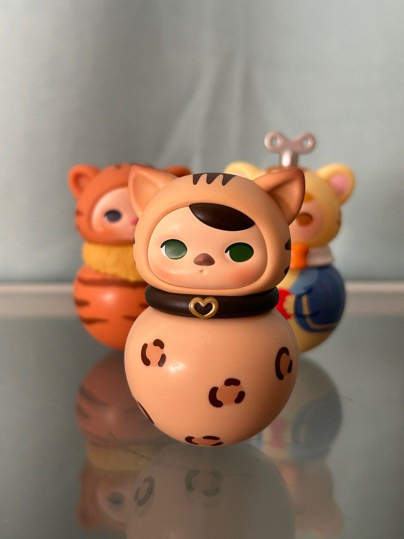 Pucky Roly Poly Kitty (Category: Designer & Blind Box Toys) located in Quezon City. Submitted by defkey (Listing ID 1327955908, Image 2). Description: Complete with box card foil Bengal Red Tabby Windup MOP: BPI, Maya, Gcash MOD: SDD, J&T, LBC.