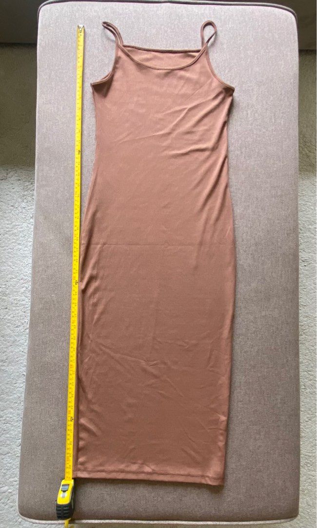 Brown bodycon/body hugging dress (Category: Dresses) located in Pasay City. Submitted by rewearcloset (Listing ID 1338162923, Image 1). Description: Decluttering Length: 41 inches Waist: 13 inches (but stretchable up to 18”) .