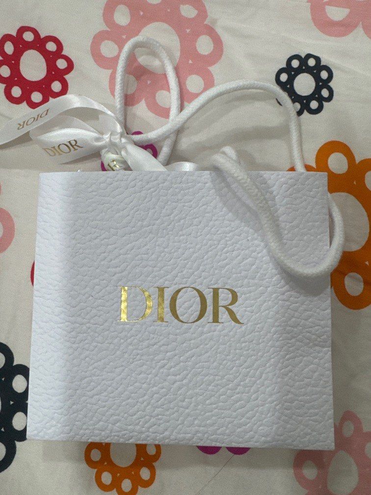 Christian Dior Paper Bag (Mini) (Category: Luxury Accessories) located in Manila. Submitted by krisceluy (Listing ID 1338231458, Image 1). Description: Still with scent and ribbon.