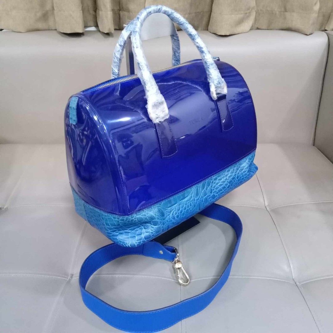 Furla Large Blue Croc Jelly Bag With Strap (Category: Luxury Bags & Wallets) located in Taguig. Submitted by esa.agustin (Listing ID 1338200027, Image 2). Description: Original Furla large boston type jelly and croc leather bag. With dust bag, lock and strap. Made in Italy..