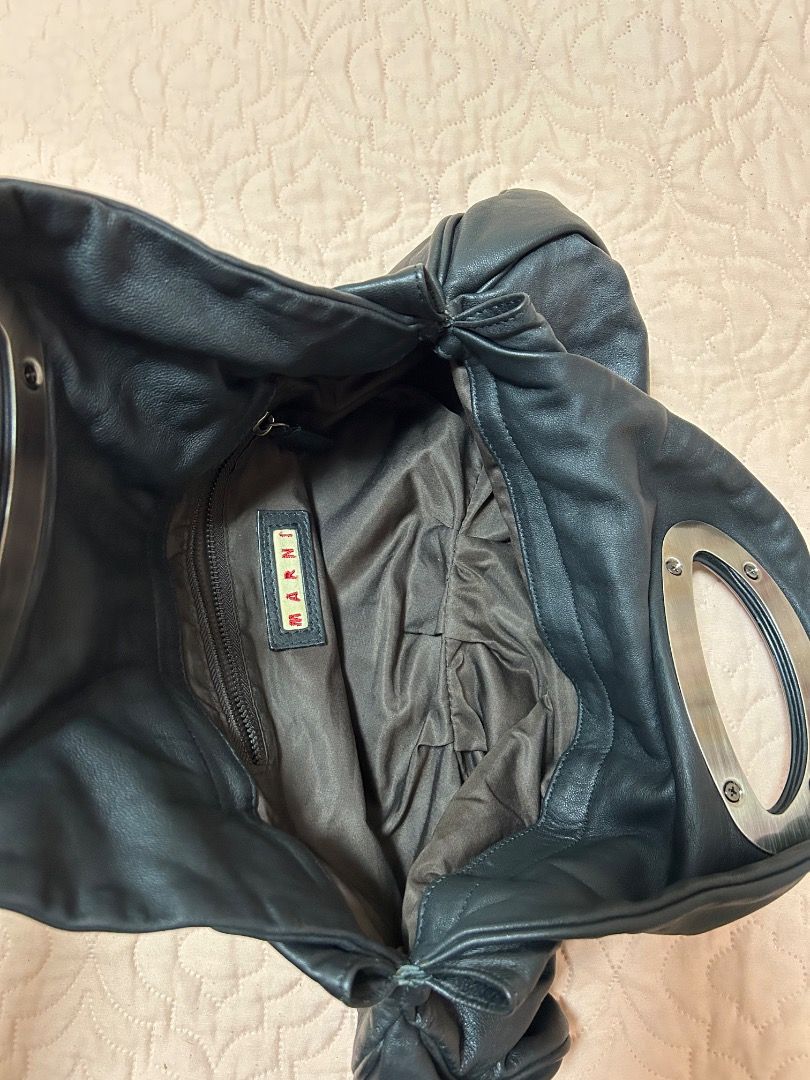 Leather handbag (Category: Luxury Bags & Wallets) located in Quezon City. Submitted by pink_lantern2 (Listing ID 1338145851, Image 2). Description: Brand is Marni. Authentic leather bag. Used a few times only. Size is small to medium. No closure zipper. Rfs not using.