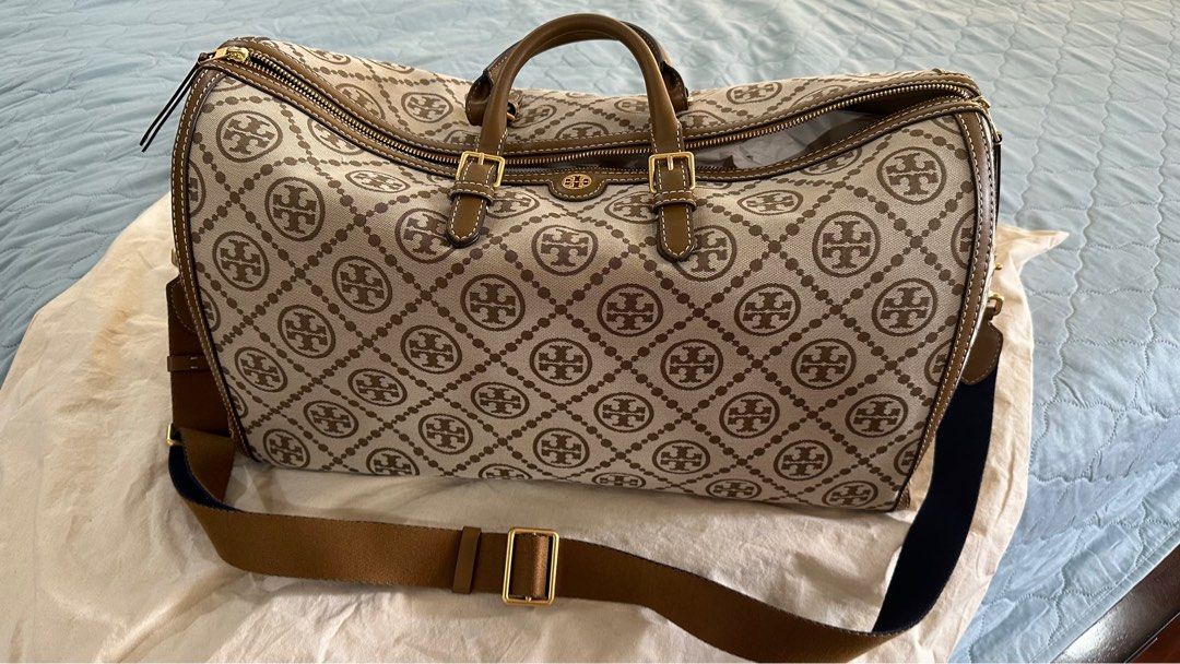 Tory Burch Monogram Jacquard Oversized Duffle Bag (Category: Luxury Bags & Wallets) located in Las Pinas. Submitted by pamshopper (Listing ID 1338167557, Image 1). Description: Brand new Oversized Duffle Bag in Hazel Color Dimensions: Length :20inches Height : 12inches Width : 9inches With Tory Burch dust bag .
