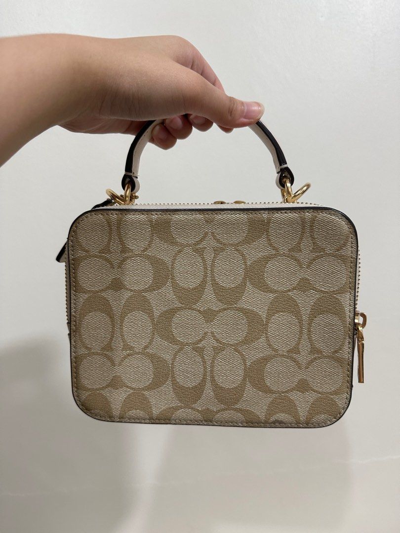 Coach mini camera bag in signature canvas (Category: Luxury Bags & Wallets) located in Quezon City. Submitted by by.apreloved (Listing ID 1338398912, Image 2). Description: -Original from the coach outlet store - Used only thrice! - Comes with long chain strap - Price is negotiable. Lowballers will be ignored - rfs: decluttering.