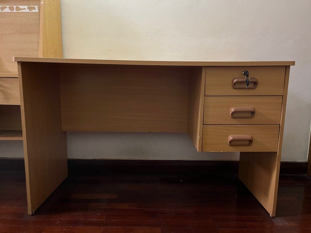 Solid wood study table with 3 lockable drawers (Category: Tables & Sets) located in Kuala Lumpur. Submitted by clarissacho (Listing ID 1338446621, Image 1). Description: Wooden study table with 3 lockable drawers, in great condition Buyer can arrange own transportation, pick up at Damansara area.