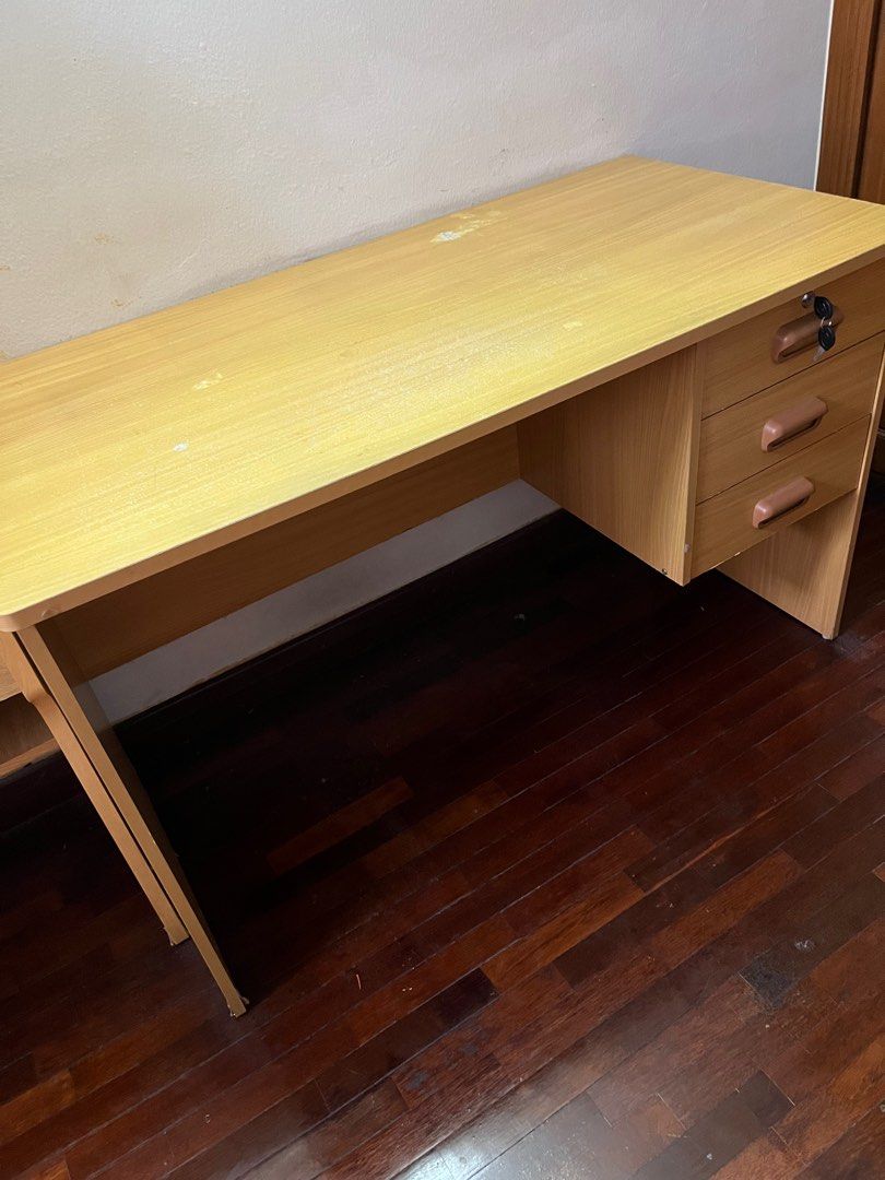 Solid wood study table with 3 lockable drawers (Category: Tables & Sets) located in Kuala Lumpur. Submitted by clarissacho (Listing ID 1338446621, Image 2). Description: Wooden study table with 3 lockable drawers, in great condition Buyer can arrange own transportation, pick up at Damansara area.