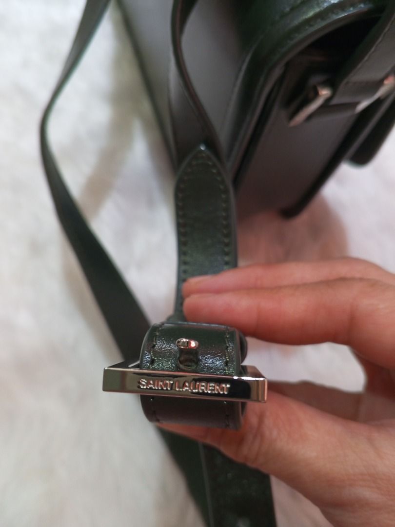 YSL SOLFERINO SLING BAG small (Category: Luxury Bags & Wallets) located in Davao. Submitted by thrift_luxefinds (Listing ID 1338386756, Image 2). Description: YSL SOLFERINO in hunter green color, calfskin leather in silver hardware, adjustable strap, with card slot and pocket inside. Bag is in pristine condition. With dust bag and box. Japan sourced. Ready to ship. Price is negotiable..