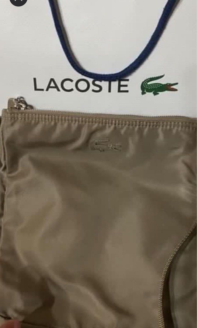 Original lacoste sling bag (Category: Luxury Bags & Wallets) located in Manila. Submitted by hellokittyme99 (Listing ID 1338619464, Image 1). Description: Original lacoste sling bag bought in duty free shops. 9x9 inch. Good quality . Heavy duty. Mop gcash. .