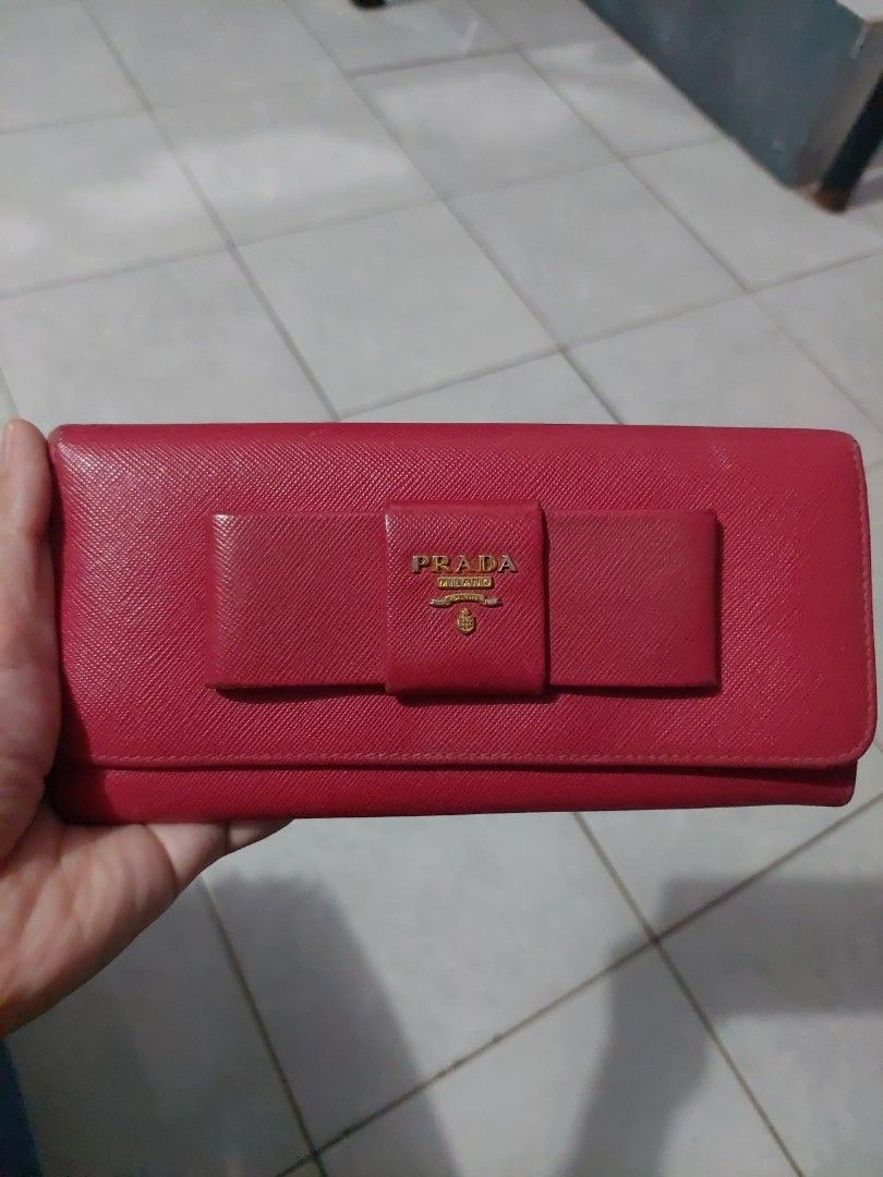 Authentic Prada Pink Saffiano Flap wallet with bow (Category: Luxury Bags & Wallets) located in Rizal. Submitted by c_albert (Listing ID 1338516197, Image 2). Description: Good condition with signs of usage please see the photos.