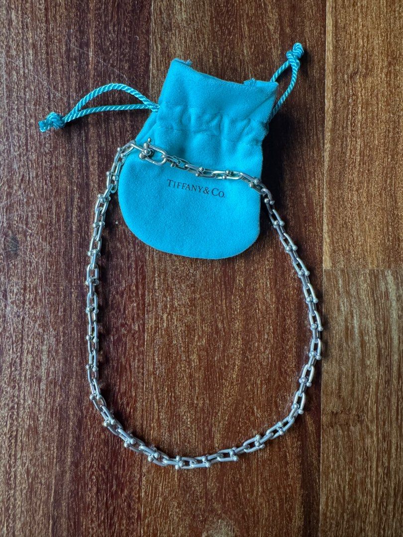 Tiffany & Co Hardware Silver Necklace (Category: Jewelry) located in Singapore. Submitted by toberss (Listing ID 1338532309, Image 1). Description: - Used Tiffany HardWear Small Link necklace in silver - Rarely worn. Taken to Tiffany store for cleaning after each use - 18” long - Purchased from Tiffany & Co Kuala Lumpur Boutique in 2023 - Comes with original box - Receipt will not be provided - Non-negotiable.