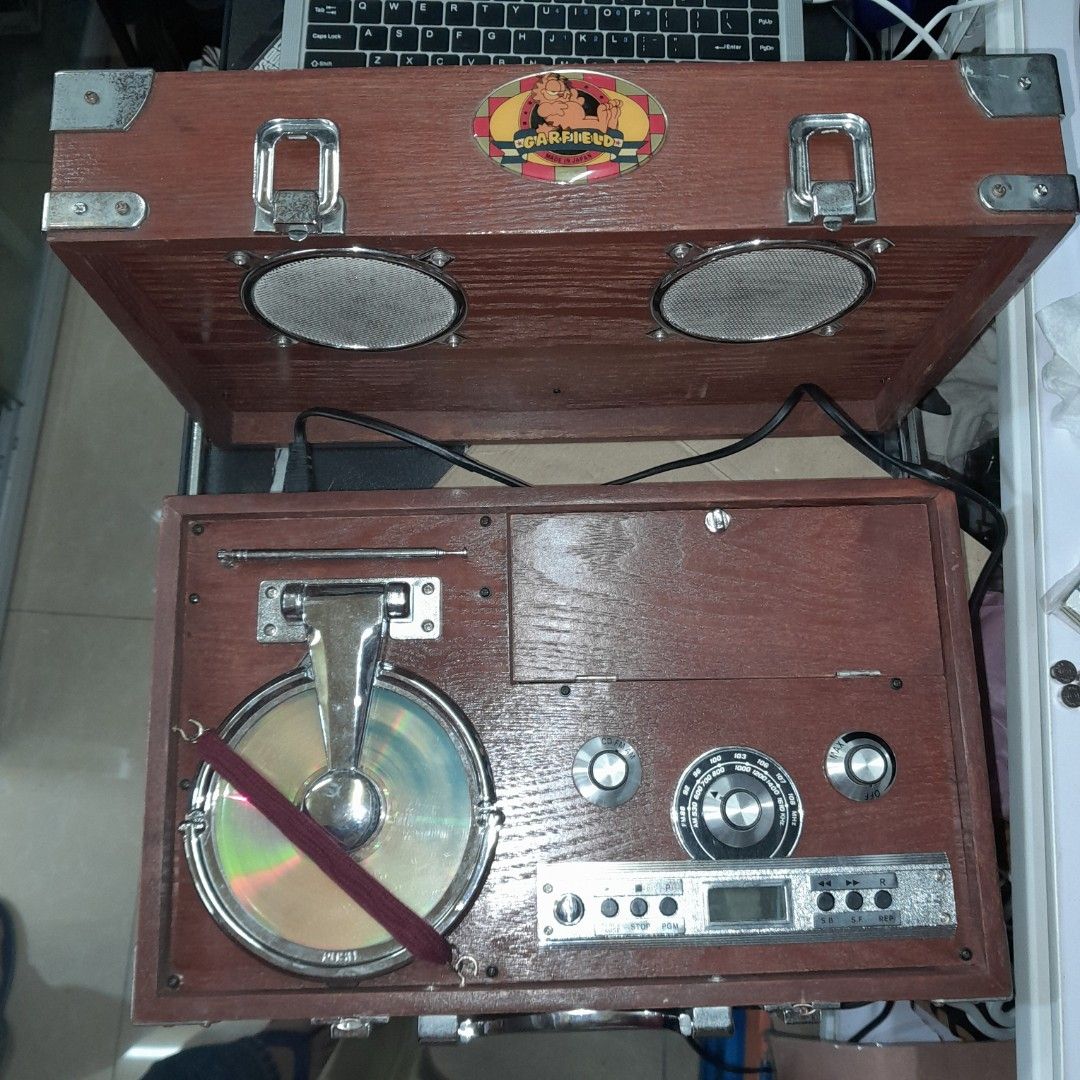 Wooden Radio CD Player (Category: Portable Music Players) located in Baguio. Submitted by shellcollector (Listing ID 1338541257, Image 1). Description: Portable wooden radio CD player Retro vintage look Working radio AM and FM Working CD player Faulty CD cover lock, needs strap to close and play CD 4800 Pesos Baguio loc Shipping at buyer's cost.