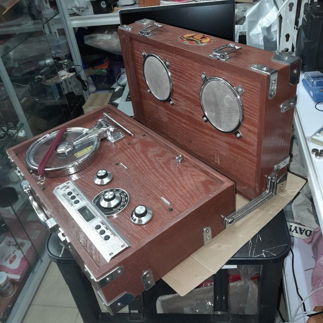 Wooden Radio CD Player (Category: Portable Music Players) located in Baguio. Submitted by shellcollector (Listing ID 1338541257, Image 2). Description: Portable wooden radio CD player Retro vintage look Working radio AM and FM Working CD player Faulty CD cover lock, needs strap to close and play CD 4800 Pesos Baguio loc Shipping at buyer's cost.