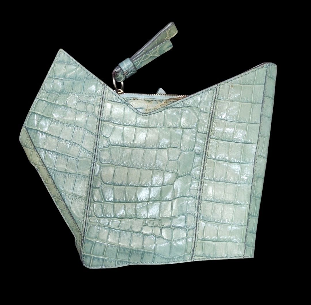 CHLOE Freja Origami Clutch (Category: Luxury Bags & Wallets) located in Digos. Submitted by emmanuel28 (Listing ID 1338475079, Image 2). Description: CHLOE Freja Origami Clutch OCEANBLUE COLOR CROCODILE SKIN EMBOSSED AUTHENTIC Made in ITALY Height: 10 inches Length: 11 inches ZIPPERS ARE WORKING SMOOTHLY BUTTONS SNAPS TIGHTLY ITEM HAS STAIN (PLS SEE 2ND TO THE LAST PHOTO) SLIGHTLY DISCOLORATION OF FADING DUE TO LEATHER NATURAL OXIDATION LOCATION: