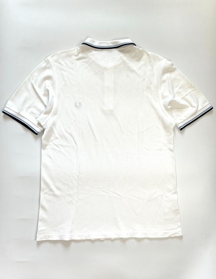 Fred Perry White Slim Fit Polo Shirt (Category: Tshirts & Polo Shirts ) located in Marikina City. Submitted by jjramo (Listing ID 1338782017, Image 2). Description: Fred Perry White Slim Fit Polo Shirt Size: M Dimensions: W20" x L26.5" Condition: Excellent; No issues Shipping shouldered by buyer Payment: GCash / BPI.