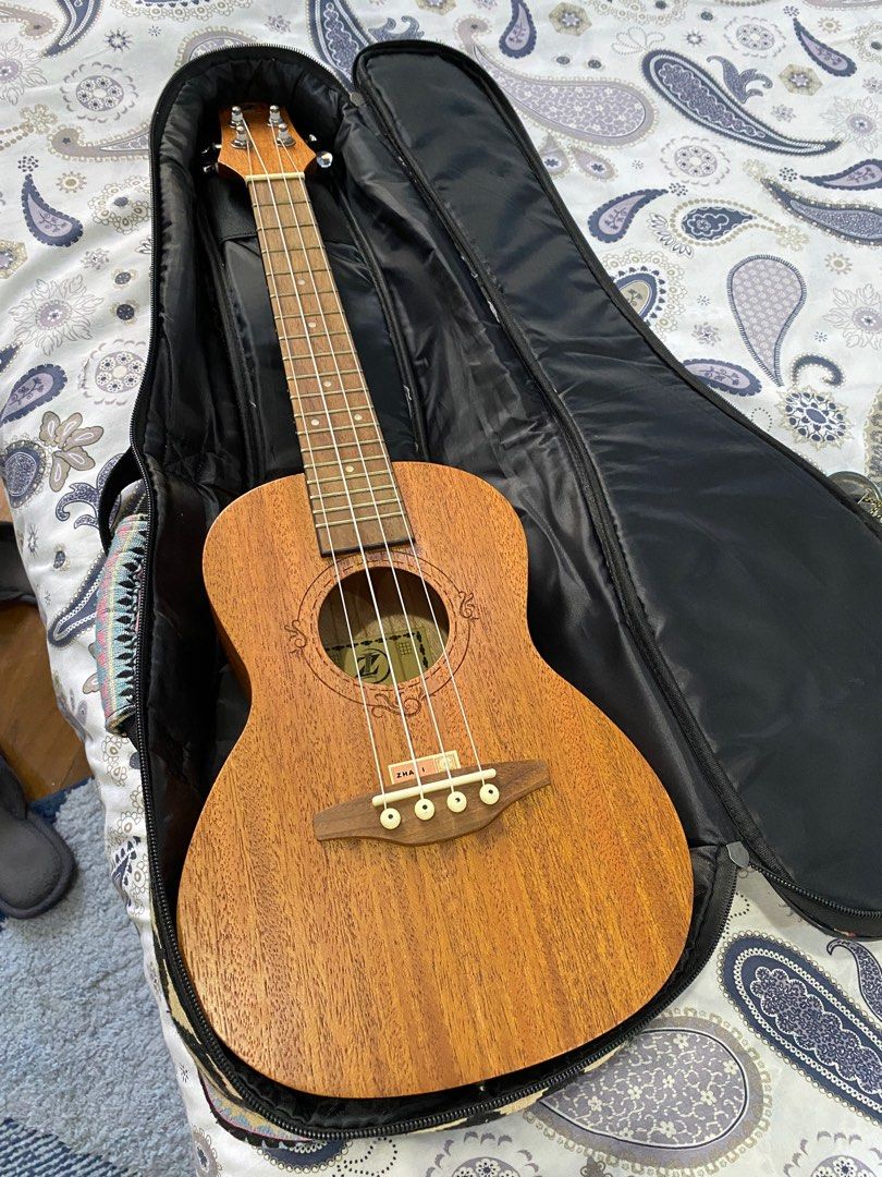 Iz Concert Ukulele with Case (Category: Musical Instruments) located in Las Pinas. Submitted by dumpsterfire101 (Listing ID 1338684722, Image 2). Description: - bought the uke for 2500+ and case for around 800 - 3+ years old - tuners are chipped and some parts rusted, but otherwise in really good condition. - no visible scratches on body - approx 15” high RFS: I don’t use it that much.