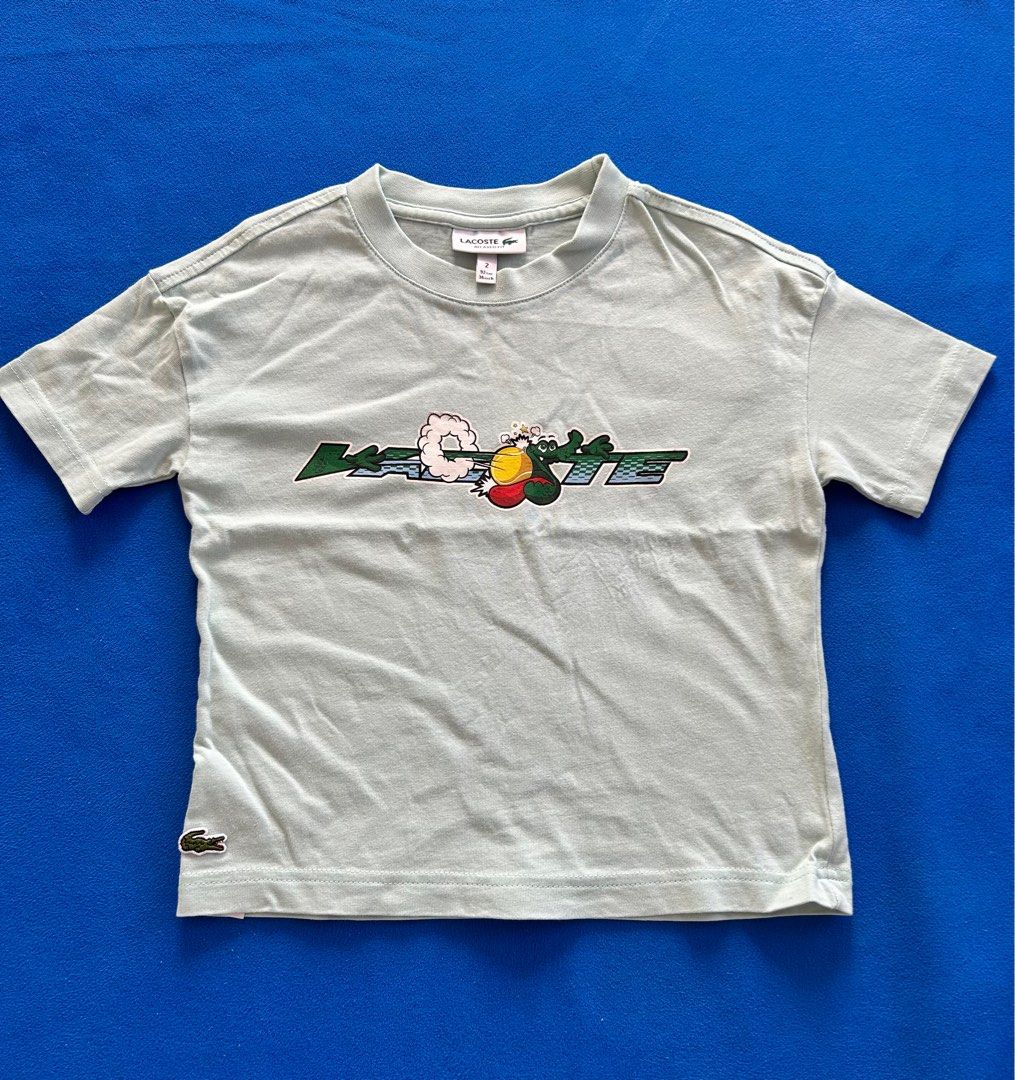Lacoste Toddler Boy Oversized Shirt (Category: Babies & Kids Fashion) located in Lipa City. Submitted by bituinpreloved (Listing ID 1338661868, Image 1). Description: Lacoste Oversized Shirt for Toddlers color: mint green size: 2y (runs big) **almost new**.