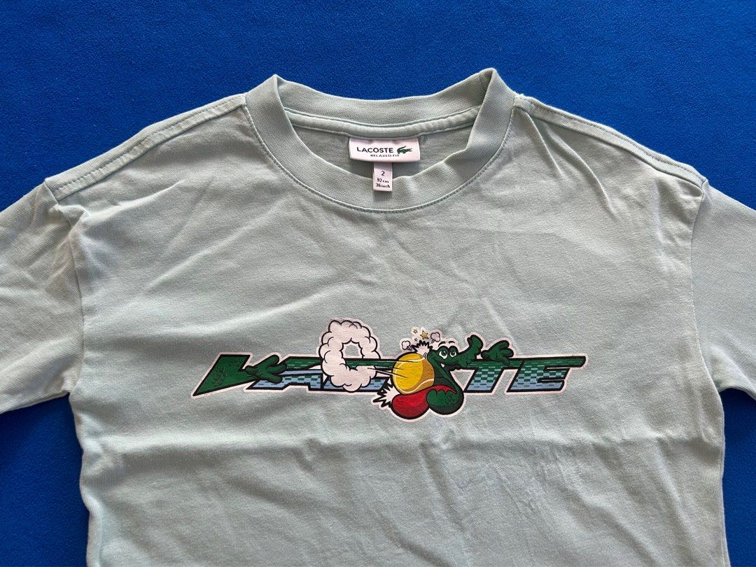 Lacoste Toddler Boy Oversized Shirt (Category: Babies & Kids Fashion) located in Lipa City. Submitted by bituinpreloved (Listing ID 1338661868, Image 2). Description: Lacoste Oversized Shirt for Toddlers color: mint green size: 2y (runs big) **almost new**.
