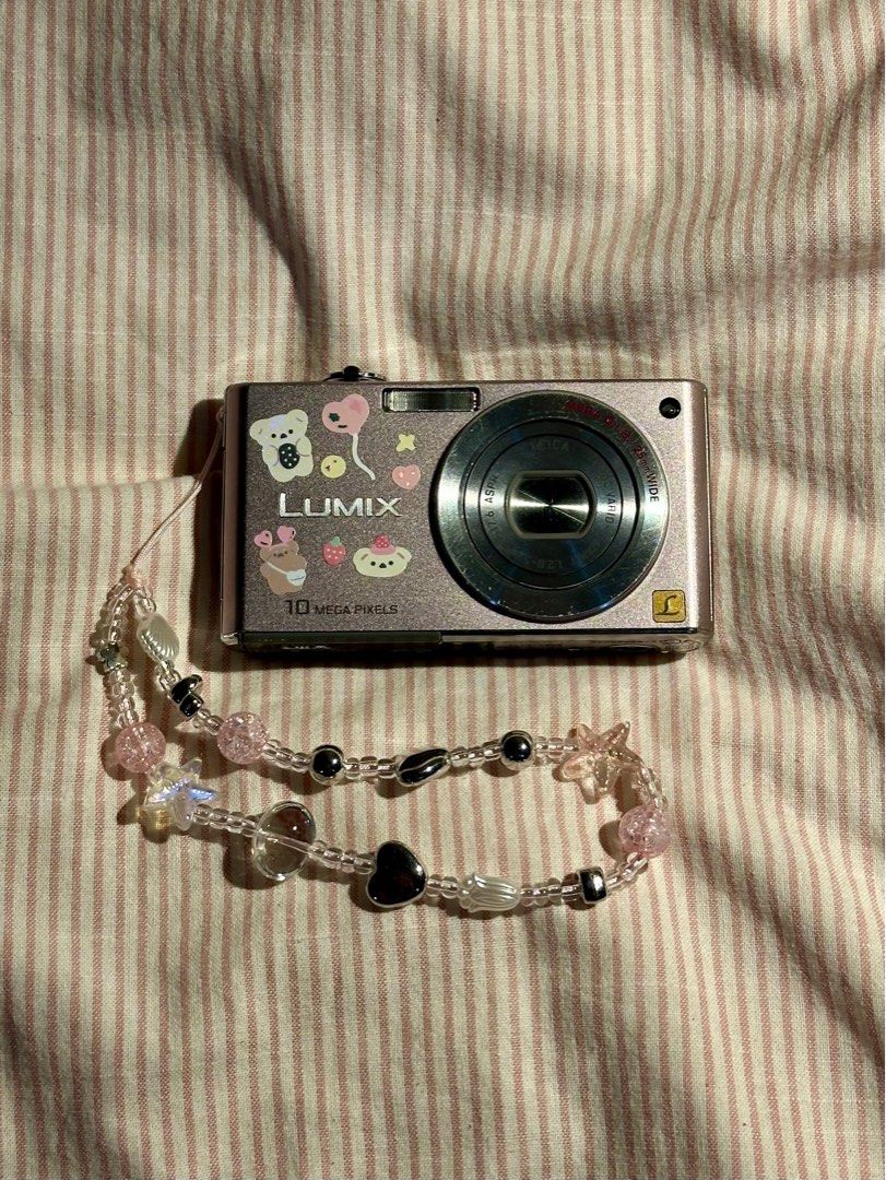 LUMIX DIGICAM DMC (Category: Cameras) located in Mandaluyong City. Submitted by madb888 (Listing ID 1338748297, Image 1). Description: NO FUNCTIONAL ISSUES‼️🙏 rare and cute light pink color 🙂‍↕️ INCLUSIONS : Camera unit Original Battery Strap.