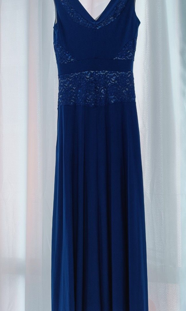Mags Evening Long Gown (Category: Evening dresses & gowns) located in Manila. Submitted by mhonicz (Listing ID 1338742585, Image 3). Description: Mags Evening Long Gown - Color : Dark Royal Blue - V neck style, sleeveless w/ slit - Semi satin fabric with double linings - Tag, Mags - Fit medium to large body frame - Waist line 26 to 30 - Suitable in any formal / evening occasions - RFS: one time use (evening party) needs to declutter - Mode of pay