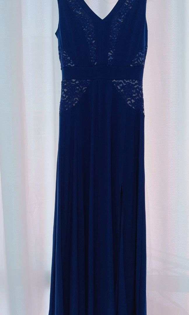 Mags Evening Long Gown (Category: Evening dresses & gowns) located in Manila. Submitted by mhonicz (Listing ID 1338742585, Image 1). Description: Mags Evening Long Gown - Color : Dark Royal Blue - V neck style, sleeveless w/ slit - Semi satin fabric with double linings - Tag, Mags - Fit medium to large body frame - Waist line 26 to 30 - Suitable in any formal / evening occasions - RFS: one time use (evening party) needs to declutter - Mode of pay