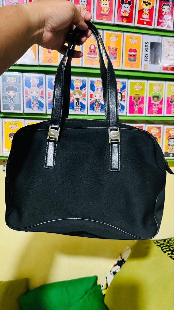 Salvatore Ferragamo Handbag Nylon (Category: Luxury Bags & Wallets) located in Manila. Submitted by tanjohnrn (Listing ID 1338750203, Image 1). Description: Salvatore Ferragamo Nylon Material Handbag Used but not abused 9-9.5/10 Originally bought in Japan Used moderately No signs of abuse With noticeable signs of usage Includes dust bag only MOP: Gcash / BPI For NCR buyer only Shipping: lalamove, grab express only. Cannot accommodate local courie