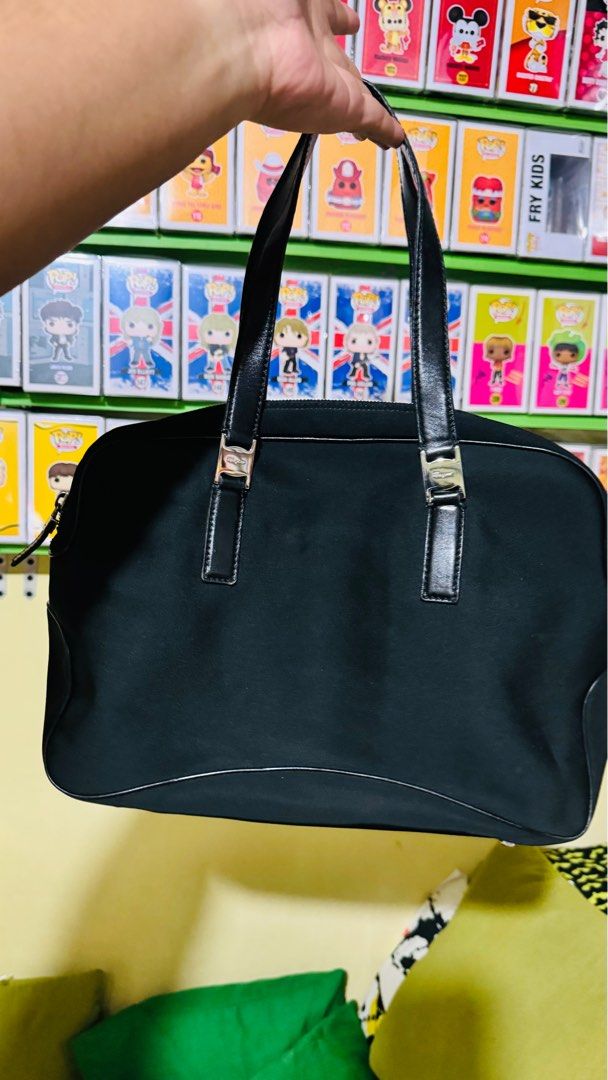 Salvatore Ferragamo Handbag Nylon (Category: Luxury Bags & Wallets) located in Manila. Submitted by tanjohnrn (Listing ID 1338750203, Image 3). Description: Salvatore Ferragamo Nylon Material Handbag Used but not abused 9-9.5/10 Originally bought in Japan Used moderately No signs of abuse With noticeable signs of usage Includes dust bag only MOP: Gcash / BPI For NCR buyer only Shipping: lalamove, grab express only. Cannot accommodate local courie