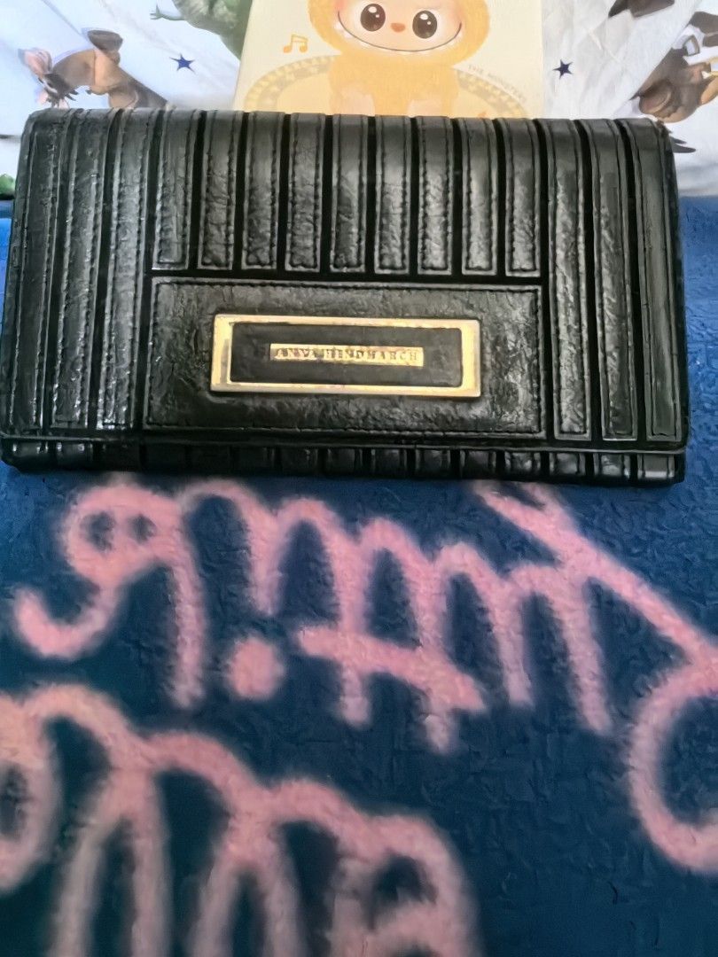 Anya Hindmarch long wallet (Category: Luxury Bags & Wallets) located in Quezon City. Submitted by uptrendglam (Listing ID 1338876089, Image 3). Description: Anya Hindmarch long wallet with 7 card slots, coin and 3 bill slots. Issue is on the hardware. Guaranteed authentic. Last price posted..