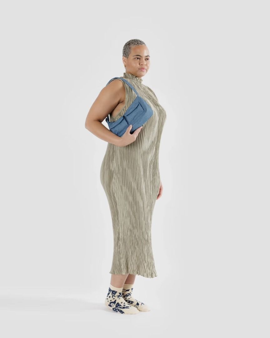 Baggu Cargo Shoulder Bag (Digital Denim) (Category: Shoulder Bags) located in Marikina City. Submitted by chaolongshops (Listing ID 1338910827, Image 2). Description: A baguette style purse with two external flap pockets for quick access to your essentials. Two exterior flap pockets with magnetic closure Measures 4.7" H × 11" W × 3" L Adjustable 29.5" quilted strap Recycled heavyweight nylon with recycled ripstop lining Machine washable Recycled 