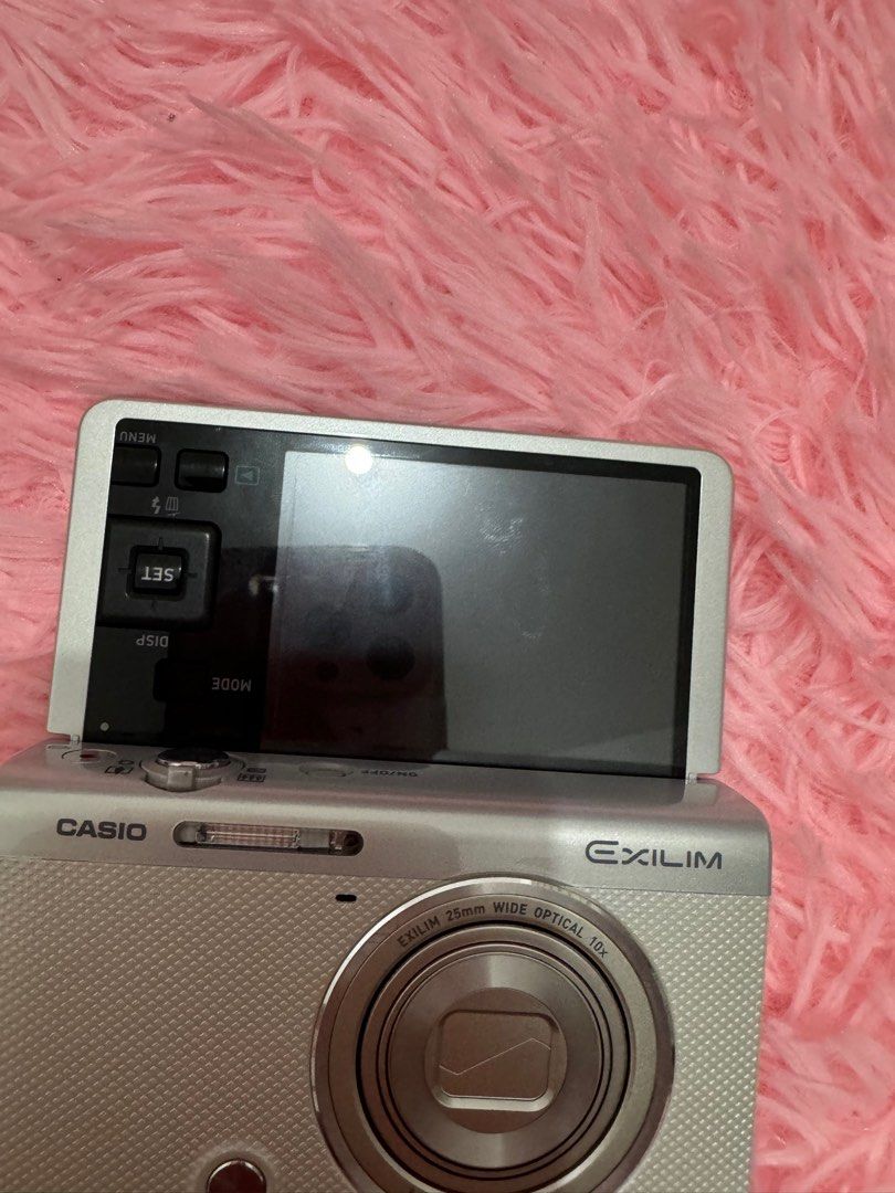 Casio Exilim EX-ZR60 (Category: Cameras) located in Angeles City. Submitted by preluvs_stuff (Listing ID 1338938050, Image 2). Description: Casio Exilim EX-ZR60 (no box) in White! : 17,000 FREE SHIPPING! NO ISSUE! Inclusion: - Camera Unit - 64 gb SD Card - Universal Charger - Case - Original Battery - SD Card reader for USB C - Camera bead charm must read: - this is flippable cam! super nice and rare - 16.1 megapixels & 10x optical zoom - 1080/60