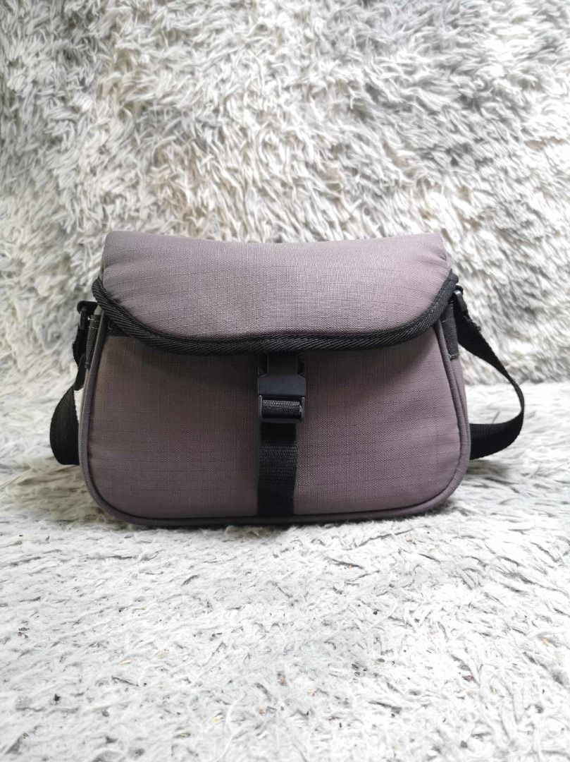 Gray Flap Camera Sling Bag (Category: Camera Bags & Carriers) located in Santa Cruz. Submitted by jmy_surplus.2 (Listing ID 1338902857, Image 1). Description: Size ; L - 8 W - 11 Color ; Gray Type ; Camera Bag Brand ; No brand Material ; Nylon Style ; Gray Flap Camera Bag MY 20 JMY 4.