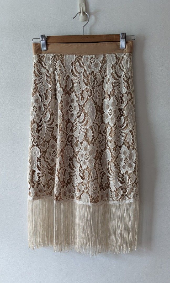 Lace skirt with boho fringe (Category: Skirts) located in Mandaluyong City. Submitted by clf97 (Listing ID 1334201582, Image 1). Description: Dainty lace skirt with bohemian fringe, perfect for flapper themed parties. Very trim waist..