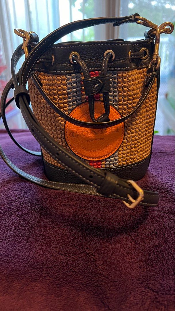 COACH DEMPSEY BUCKET DRAWSTRING SHOULDER BAG (Category: Luxury Bags & Wallets) located in Cavite. Submitted by everythingnicehere (Listing ID 1334294947, Image 2). Description: ✅ Original 💯 from Canada ✅ Ready to ship ✅ Excellent condition - Lightly used; still in pristine quality. No defects/flaws. Straw and refined pebble leather | One credit card slot | Drawstring closure, fabric lining | Detachable handle with 5 1/2" drop | Detachable strap 