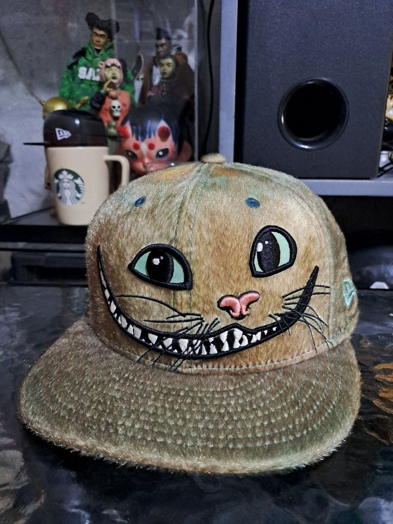 New Era Cheshire Cat (Category: Caps & Hats) located in Makati City. Submitted by aizen15 (Listing ID 1334231007, Image 1). Description: New Era x Alice in wonderland Cheshire Cat Size 7 3/8 issue: minor fade on sweatband (Front).