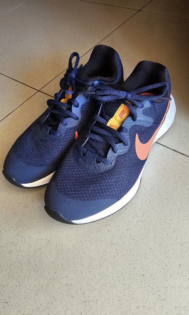 light blue and orange nike shoes