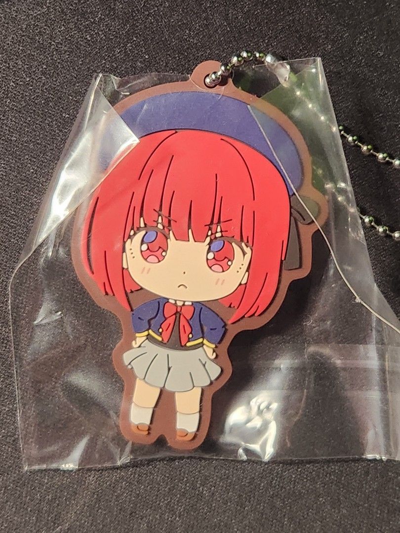 OSHI NO KO RUBBER BANDAI GACHAPON KEYCHAIN — KANA (Category: J-Wave Merchandise) located in Singapore. Submitted by hai97802 (Listing ID 1334354922, Image 1). Description: Selling/Trading KANA keychain. Msg me to offer keychain trade or pay $6 for keychain. Meet at my place only. I got 4 KANA duplicates (MY LUCK WAS SO BAD FR) so don't be worried about it being sold out. Brand new sealed in plastic packaging (I can give you the gachapon ball as w