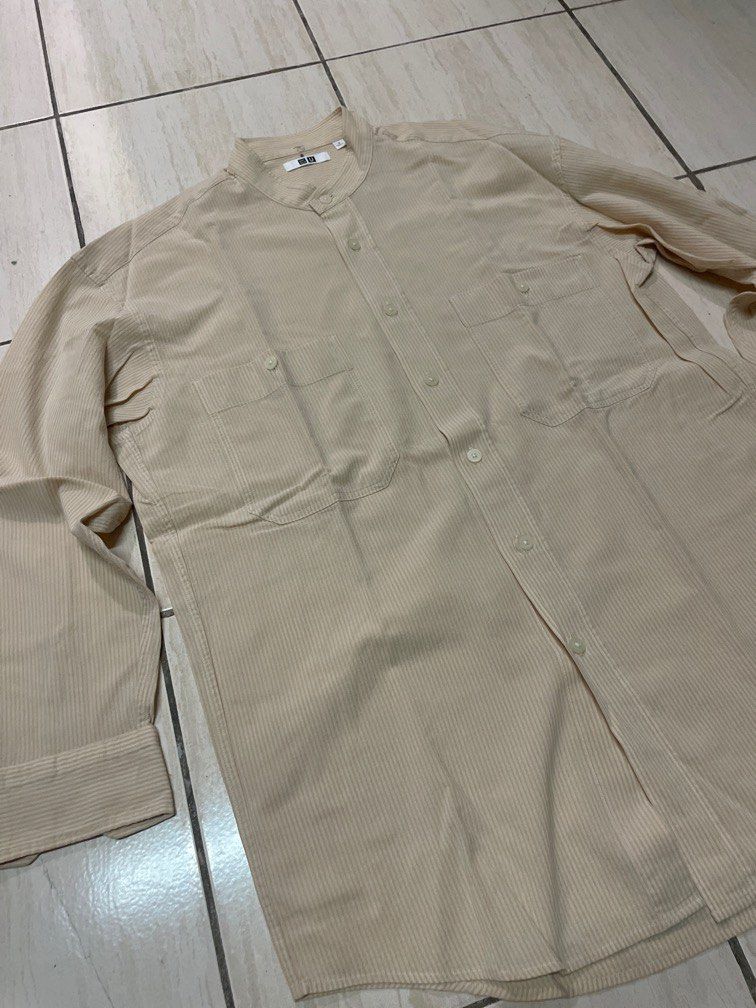Uniqlo Stand Collar Button down Long Sleeve Shirt (Category: Formal Shirts) located in Caloocan City. Submitted by sonner9728 (Listing ID 1334233140, Image 3). Description: Uniqlo Stand Collar Button down Long Sleeve Shirt Size on tag: Small Color: cream and white stripes Rfs: Decluttering Minor issue: number written on collar 250+Sf .
