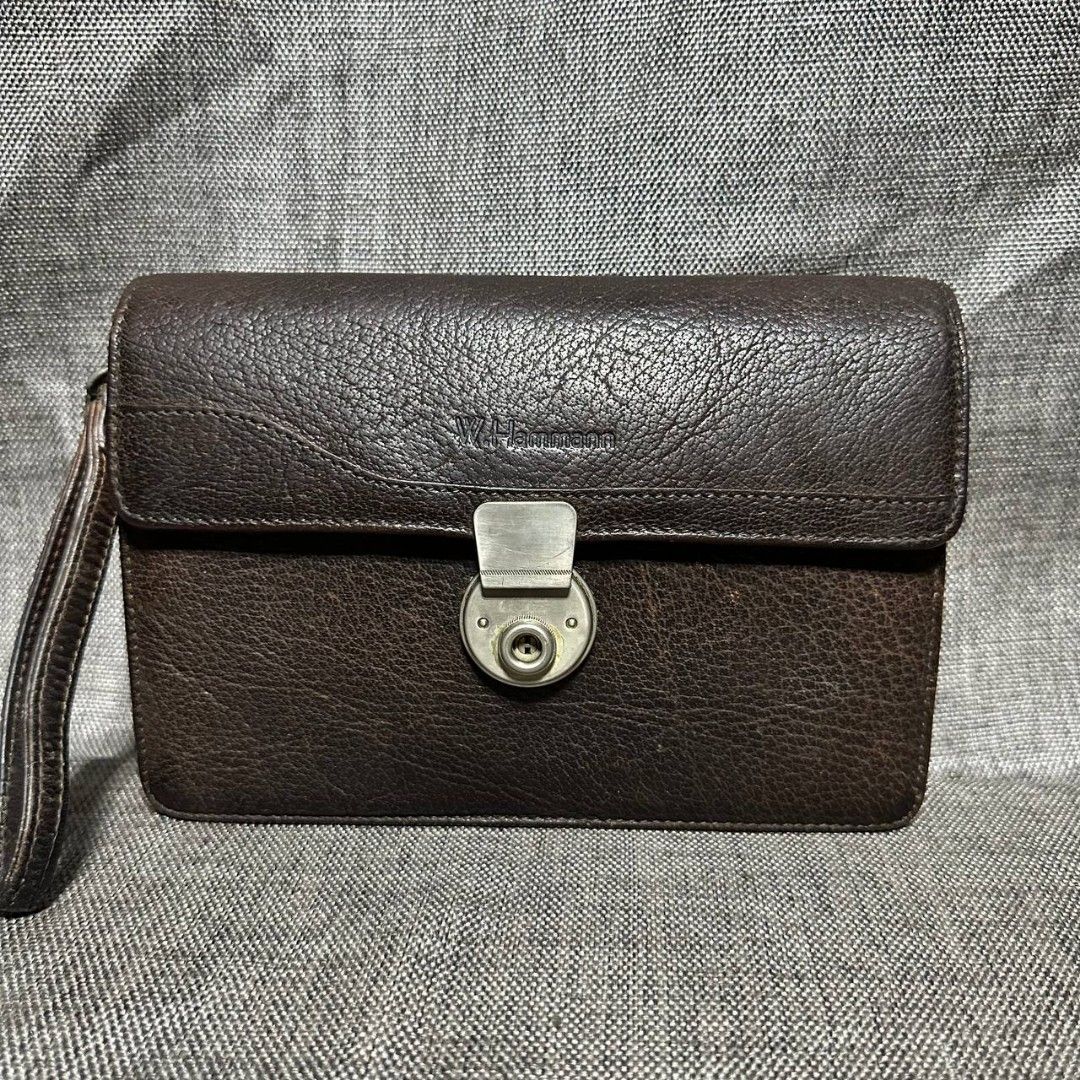 W. Hammann clutch bag (Category: Luxury Bags & Wallets) located in Manila. Submitted by greyinfash06839 (Listing ID 1334361643, Image 1). Description: 🤍Price: 2,900 pesos only 🤍Item: W. Hammann clutch bag 🤍Brand: W. Hammann 🤍Matirial: Leather 🤍Quality: Original 🤍color: Brown 🤍Size: Small 🤍Dimension. H: 6 L: 9 W: 2 🤍Sex: For Men 🤍Issue: Vintage 🤍Condition Rate: 8/10 🤍Other info:.