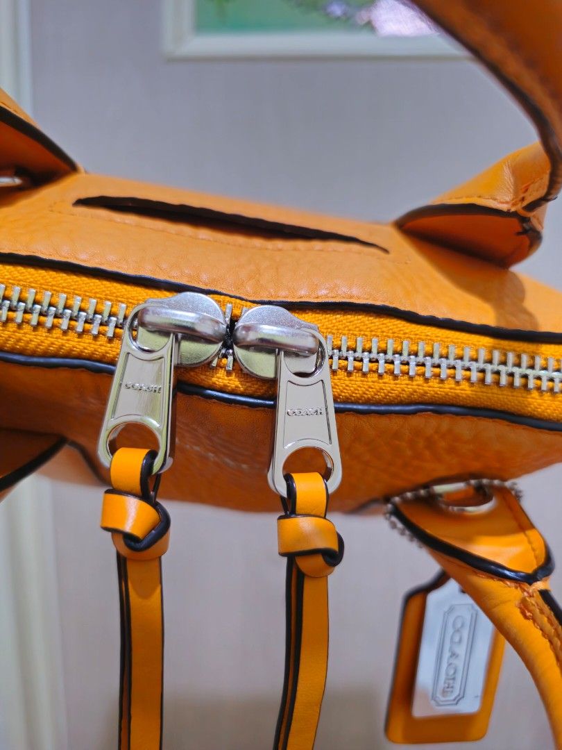 Auth Coach Mini Bleecker Preston Satchel In Mandarin Pebbled Leather (Category: Luxury Bags & Wallets) located in Las Pinas. Submitted by andthelike (Listing ID 1339130992, Image 3). Description: Auth Coach Mini Bleecker Preston Satchel In Mandarin Pebbled Leather Refer to the photos to see the condition of the bag Purchased as preloved but never used..