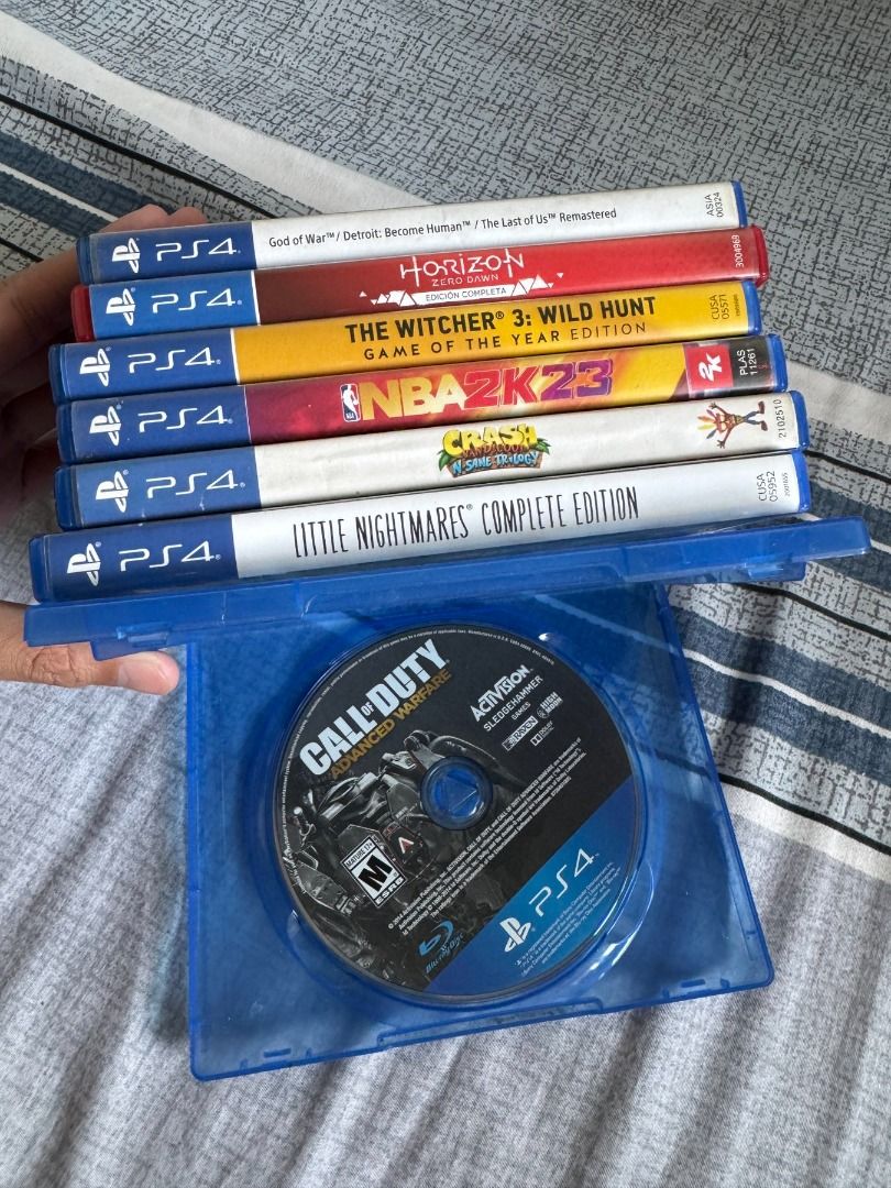 PS4 Games Bundle 8 CDs (Take All or buy per CD) (Category: PlayStation) located in Pasig City. Submitted by robbiseraphin (Listing ID 1339114571, Image 1). Description: Take all 8 CD's for 3k. Individual prices: 1. God of War + Detroit Become Human bundle - 800 php 2. Horizon Zero Dawn - 500 php 3. The Witcher 3 Wild Hunt: Game of the Year Edition - 500 php 4. NBA 2k23 - 500 php 5. Crash Bandicoot N-Sane Trilogy - 400 php 6. Little Nightmares: Co