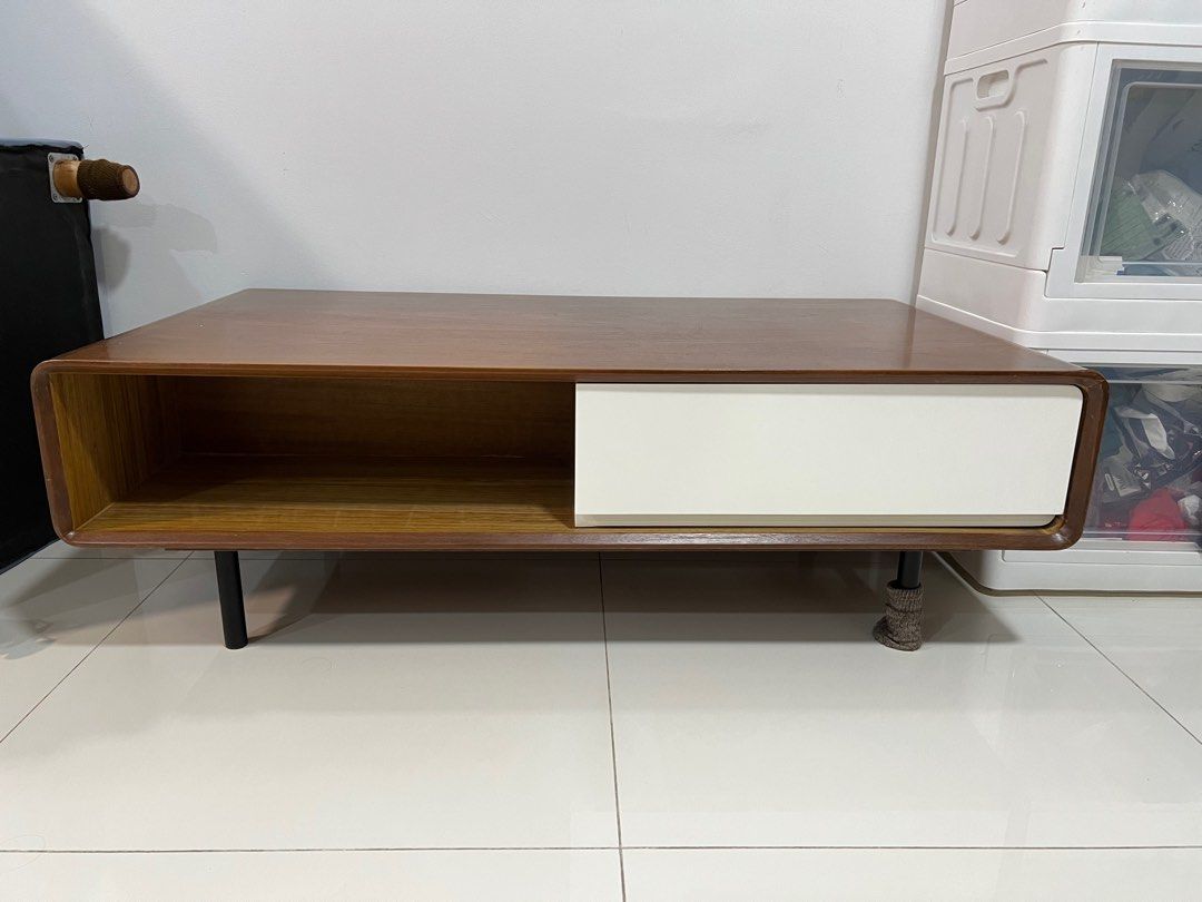 Solid Wood Coffee Table (Category: Tables & Sets) located in Singapore. Submitted by eesann (Listing ID 1338993754, Image 2). Description: Solid wood coffee table with two drawers and two open storage space. The dent at corner were caused by bad packaging during delivery. Used for two years and well maintained. Need two persons to move the table as it is quite heavy..