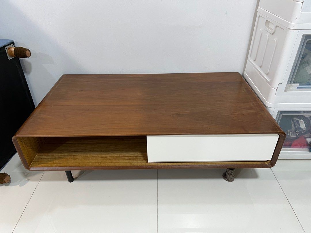 Solid Wood Coffee Table (Category: Tables & Sets) located in Singapore. Submitted by eesann (Listing ID 1338993754, Image 1). Description: Solid wood coffee table with two drawers and two open storage space. The dent at corner were caused by bad packaging during delivery. Used for two years and well maintained. Need two persons to move the table as it is quite heavy..