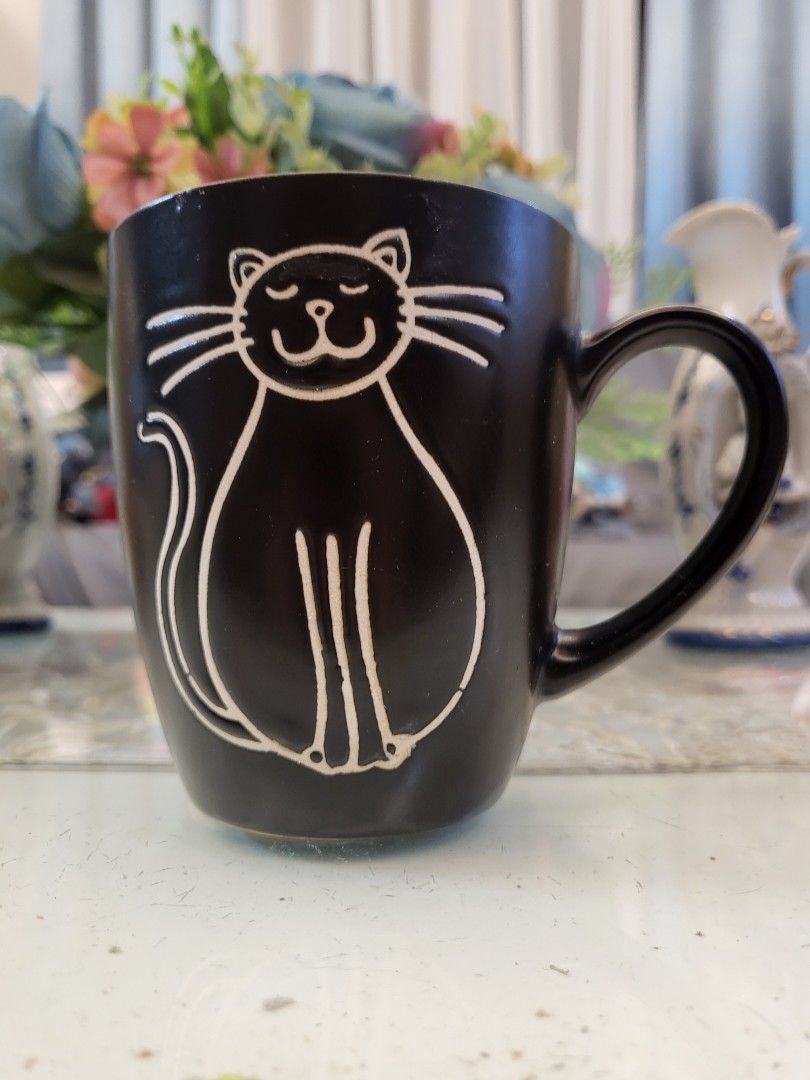 Cat Embossed Black Mug (Category: Coffee & Tea Tableware) located in San Fernando. Submitted by jpmarketplace2023 (Listing ID 1334466061, Image 1). Description: 💚 All items are authentic from Japan. 💛 MOP: GCash (❌️ GCash Protect) 🩵 MOD: LBC only (❌️ S. Checkout, COD, COP) 💙 Meet-up: Vista Mall, San Fernando, Pampanga 💜 All items are on-hand. 🧡 First to pay gets the item first. ❤️ Breakable items are packed with care and caution. Seller wil