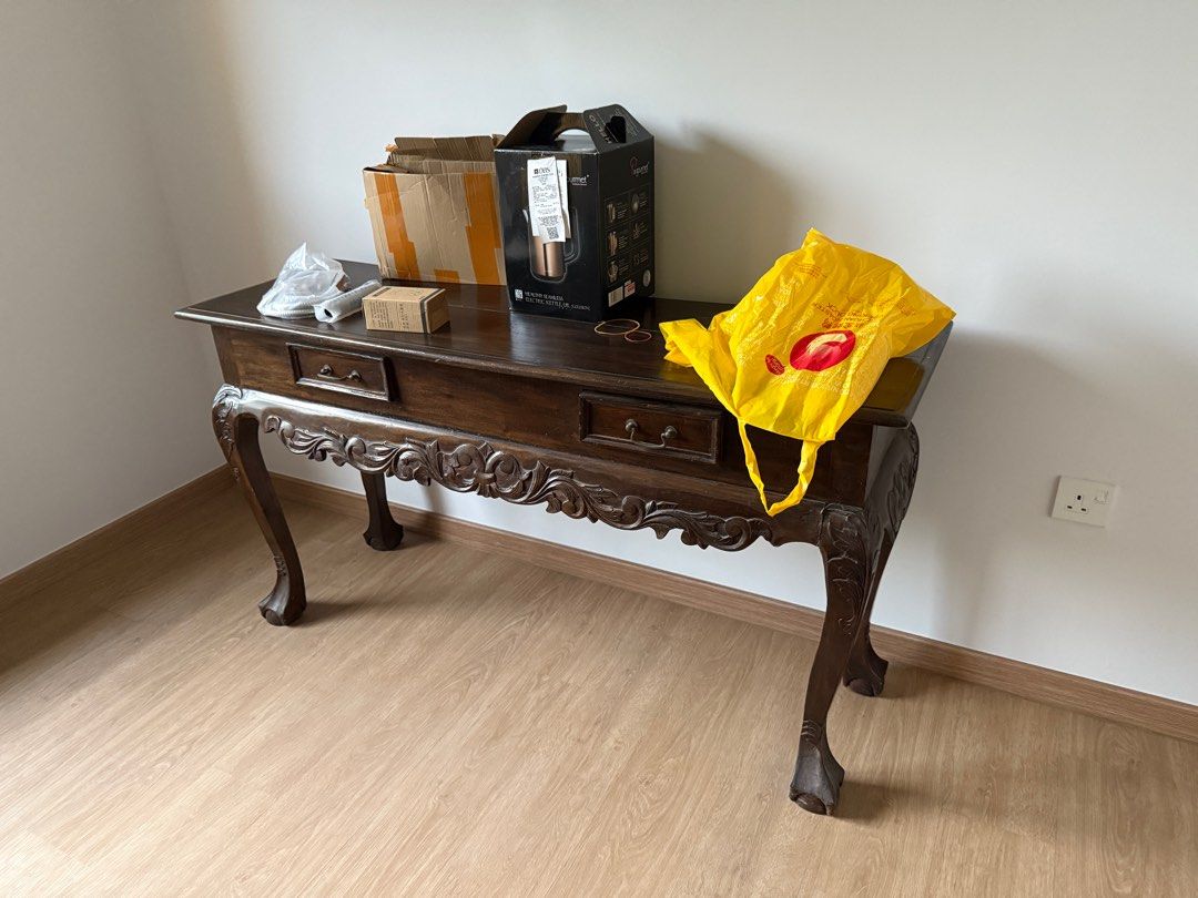 Console Table (Category: Tables & Sets) located in Singapore. Submitted by kopip3ng (Listing ID 1334387072, Image 1). Description: This is an antique-style wooden console table, often used in entryways, living rooms, or hallways for decorative purposes or storage. The detailed carvings on the legs and front drawer give it a traditional, vintage look..
