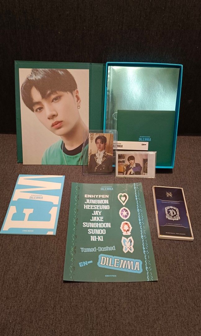 Dimension: Dilemma Album + Sunghoon PC (Category: CDs & DVDs) located in Plaridel. Submitted by rai.dln (Listing ID 1334461779, Image 2). Description: • complete inclusions • unsealed • no issue.