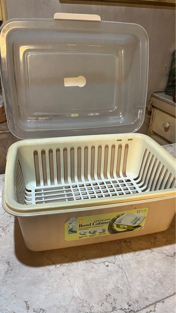 Dish cabinet drying rack (Category: Food Organization & Storage) located in Manila. Submitted by nmpc116 (Listing ID 1334424920, Image 1). Description: Plastic material Rack is removable and has grooves for dishes 16.5in length 12.5in width 10 in tall .