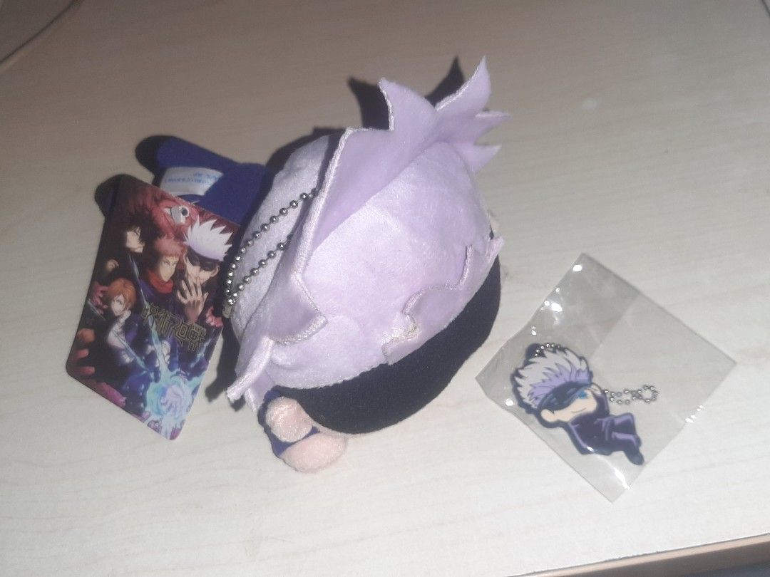 Gojo Satoru plush and rubber keychain (official) (Category: Plushies & Soft Toys) located in Tarlac. Submitted by fyozaienthusiast_ (Listing ID 1334411797, Image 1). Description: jujutsu kaisen Gojo satoru set for Php 280.00 mod: jnt/lbc mop: gcash.