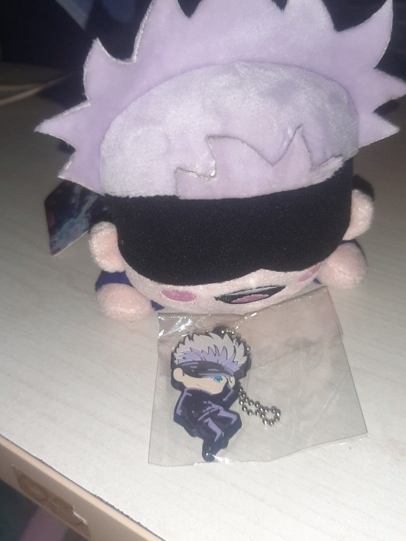 Gojo Satoru plush and rubber keychain (official) (Category: Plushies & Soft Toys) located in Tarlac. Submitted by fyozaienthusiast_ (Listing ID 1334411797, Image 2). Description: jujutsu kaisen Gojo satoru set for Php 280.00 mod: jnt/lbc mop: gcash.