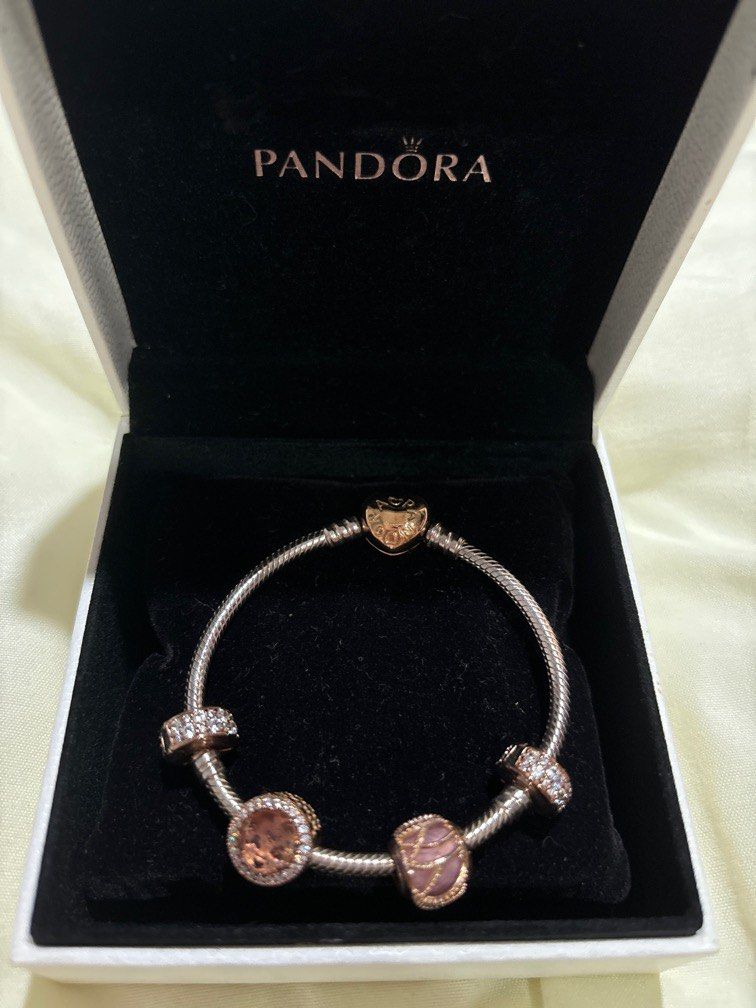 Pandora Rose Gold Charm Bracelet (Category: Bracelets) located in Paranaque City. Submitted by preloved.che (Listing ID 1334399727, Image 1). Description: Not sure what size exactly but pretty sure it’s the smallest size available includes 4 charms barely used this rfs: need funds + from an ex 🤪.
