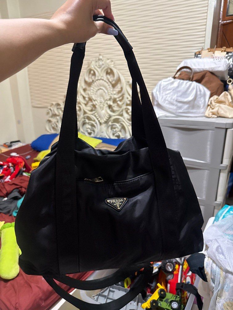 Prada 2 way nylon travel bag (Category: Luxury Bags & Wallets) located in Zamboanga. Submitted by appletrish08259 (Listing ID 1334528148, Image 1). Description: Coded Naka “p” side ng zipper puller Very nice .