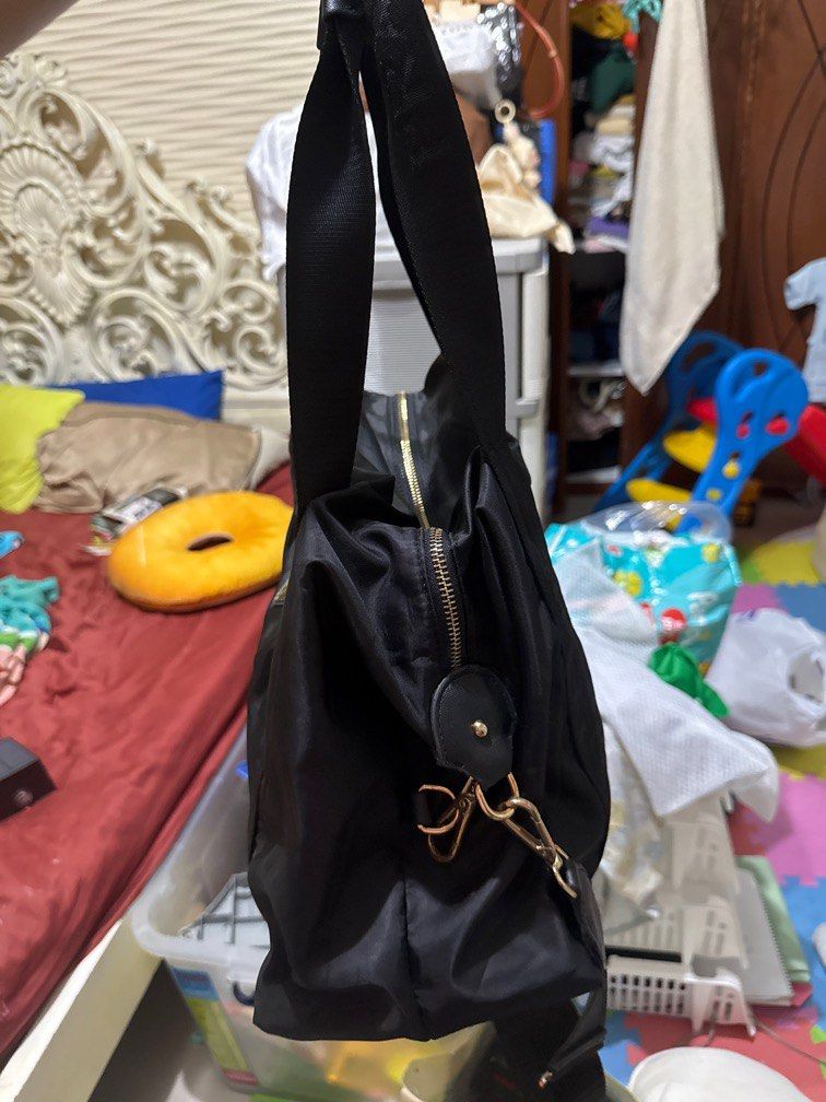 Prada 2 way nylon travel bag (Category: Luxury Bags & Wallets) located in Zamboanga. Submitted by appletrish08259 (Listing ID 1334528148, Image 2). Description: Coded Naka “p” side ng zipper puller Very nice .
