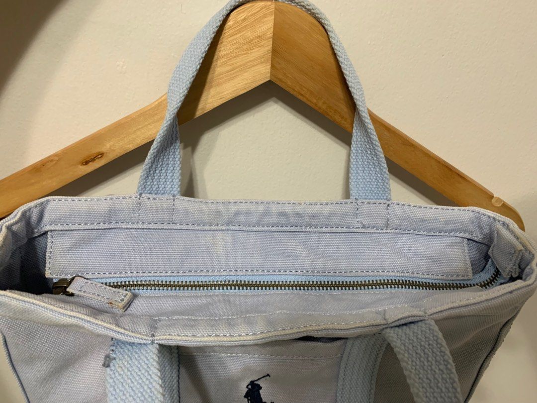 Ralph Lauren Mini Hundle Tote bag! (Category: Tote Bags) located in Olongapo. Submitted by studiogarments (Listing ID 1334499259, Image 3). Description: Ralph Lauren Hundle bag! Baby blue color way -Good Condition -Color rate 9/10 -Minimal Signs of Usage -Legit/ Authentic! -Need wash only ₱ 580 + Shipping Fee! PLEASE READ CAREFULLY! CLICK EACH PHOTO FOR MORE DETAIL! 📌Corrier: JNT EXPRESS 📌MOP: Gcash/ Cebuana/ Metrobank ⚠️Colors may very due to 